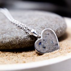 Continuing our memorial collection is this stunning heart-shaped memorial ashes necklace. A symbol of love, compassion and remembrance, this piece is a perfect way to hold a memory of a loved one close to your heart. Crafted in hallmarked sterling silver, your ashes are then held securely in place with ultra-strong clear epoxy resin. For a unique touch, we can incorporate nacre, the iridescent part of shells hand-collected near our Brighton studio. Each shell is one-of-a-kind, just like your lov Ashes In Resin, Memorial Jewelry Ashes, Ashes Necklace, Cremation Necklaces, Pet Cremation, Clear Epoxy Resin, Pet Ashes, Pendant Heart, Cremation Ashes