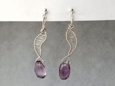 Beautiful hand woven gold thread clip on earrings, featuring natural amethyst (handcrafted with care). Unique design and handcrafted in our studio. Available in gold wire or sterling silver wire. Handmade item Size approx : H 63 x W 10 mm Lightweight invisible clip on earrings for non pierced ears and sensitive ears. Featuring unique Spiral Clip On design, with non slip silicone pad. Compare with any other types of clip on earrings, these are much more comfortable to wear. Doesn't hurt at all! This is our promise to you! They will arrive packaged in lovely jewellery box. ---------------------- For detailed guide on 'how to wear' and 'how to adjust', please check out our shop video.  How to wear it:  Push the clip onto the thinnest part of your earlobe, slide down to the desired position, i Clip-on Drop Wrap Earrings As Gift, Silver Amethyst Wire Wrapped Earrings, Purple Clip-on Jewelry As A Gift, Purple Clip-on Jewelry As Gift, Purple Clip-on Jewelry For Gifts, Purple Clip-on Jewelry For Gift, Purple Clip-on Jewelry Gift, Amethyst Wire Wrapped Drop Earrings, Elegant Handmade Wire Wrap Earrings