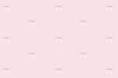 a pink wallpaper with bows on it