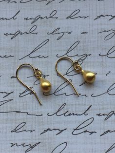 Gold Teardrop Earrings. These dainty teardrops are matte gold vermeil with gold filled French ear wires. These are the perfect minimal, dainty earrings for every day. Your earrings will arrive in a gift box. If this is a gift, I would be happy to include a card with your personal message - just let me know in the message section at checkout. Teardrop French Hook Earrings As Gift, Nickel-free Drop Pearl Earrings, Dainty Teardrop Pearl Earrings For Jewelry Making, Gold Teardrop Pearl Earrings For Pierced Ears, Dainty Hypoallergenic Pear-shaped Earrings, Dainty Pear-shaped Hypoallergenic Earrings, Dainty Gold Teardrop Pearl Earrings, Gold Teardrop Pendant Earrings With Ear Wire, Gold Teardrop Pearl Earrings With French Hook