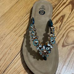 Blue And Gold Rhinestones Flip Flops Brand New Never Worn Blue Toe Post Sandals For Party, Blue Toe Post Party Sandals, Summer Jeweled Open Toe Sandals, Blue Embellished Sandals For Spring, Blue Rhinestone Round Toe Sandals, Gold Rhinestone Flip Flops For Vacation, Spring Embellished Blue Sandals, Spring Blue Embellished Sandals, Blue Non-slip Flip Flops For Spring