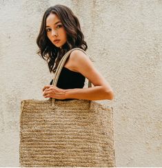 This lovely handmade oversize beach tote made with superior quality raffia and is ideal for everyday use or lounging around at the beach. Matching this oversize tote with a dress and sandals completes the overall look for a fun day out. Handmade by our balinese artisans. Size: 19.75"l x 16.50"h x 6.25"d. (50cm l x 42cm h x 16cm d). Material: raffia. Unlined Dress And Sandals, Oversized Tote, Fun Day, Beach Tote, Balinese, A Dress, At The Beach, The Beach, Overalls