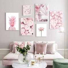 a living room filled with furniture and pictures on the wall above it's coffee table