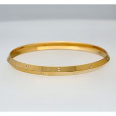 Embrace timeless elegance with this 22k gold men's kada bangle by Virani Jewelers. Crafted with care and attention to detail, this gold kada bangle for men features a classic design that exudes sophistication and style. Made from the finest 22k gold, it adds a touch of luxury to any look, making it the perfect piece of Indian gold jewelry for the modern gentleman who values quality craftsmanship and timeless design.Features• 22k yellow gold• Engraved detailsSpecifications:• Minimum Width - 6.85 Kada Bracelet Gold For Men, Modern Gold Bangle With Single Cut Diamonds, Bangle For Men, Gold Kada, Indian Gold Jewelry, Indian Jewellery Design, Gold Engraving, Gold Jewelry Indian, Modern Gentleman