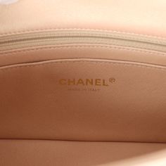 This Chanel mini classic rectangular flap bag is of iridescent beige lambskin leather with light gold tone hardware and has a front flap with signature CC turnlock closure, rear half moon pocket, single interwoven iridescent beige leather and light gold chain link shoulder/crossbody strap.The interior is lined in iridescent beige leather and features a zipper pocket with Chanel pull and an open pocket below.Collection: 22C (RFID Chip)Origin: FranceCondition: New and never worn (plastic on hardware)Accompanied by: Chanel box (damaged), Chanel dustbag, felt and COA cardMeasurements: 8" width x 5" height x 2.5" depth; 20" strap drop Designer Flap Bag With Gold-tone Logo Plaque, Luxury Beige Flap Bag With Cc Turnlock Closure, Luxury Beige Double Flap Bag, Luxury Beige Flap Bag, Beige Rectangular Flap Bag With Cc Turnlock Closure, Chanel Mini Rectangular, Chanel Box, Mini Classic, Chanel Mini