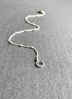 "Dainty Sterling Silver Chain Bracelet The perfect dainty chain to wear everyday! This satellite chain has such incredible shine and sparkle. Really pretty when layered with other bracelets and a terrific addition to any jewelry collection. ✦Also available in 14K gold fill - please see link below ✦For Satellite Necklace lengths - please see link below DESCRIPTION * Sterling Silver Satellite Chain, Lobster/trigger Clasp and Components * This is a delicate cable chain with accent beads of approxim Sterling Silver Adjustable Link Bracelet, Dainty Silver Chain Bracelet With Lobster Clasp, Silver Charm Bracelet With Delicate Adjustable Chain, Silver Adjustable Charm Bracelet With Delicate Chain, Silver Bracelet With Satellite Chain, Silver Bracelets With Satellite Chain, Adjustable Silver Charm Bracelet With Delicate Chain, Nickel-free Link Chain Bracelet Minimalist Style, Minimalist Bracelets With Adjustable Chain And Dangle