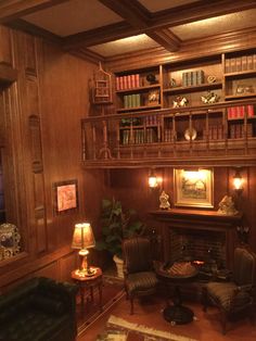 a living room filled with furniture and bookshelves next to a fire place in a wooden paneled wall