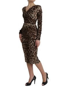 This midi dress from Dolce & Gabbana features a blend of materials and long sleeves. The leopard print design and v-neck complete the look. Model: Midi dress Color: Brown leopard pattern Material: 93% Silk 7% Elastane Lining: 97% Polyester 3% Elastane Zipper closure Logo details Made in Italy Elegant Leopard Print V-neck Midi Dress, Fitted Leopard Print V-neck Midi Dress, Elegant Leopard Print Midi Dress For Evening, Chic V-neck Leopard Print Midi Dress, Leopard Print Long Sleeve Midi Dress, Elegant V-neck Leopard Print Midi Dress, Leopard Print V-neck Evening Dress, Chic Leopard Print Knee-length Midi Dress, Elegant Knee-length Leopard Print Dress