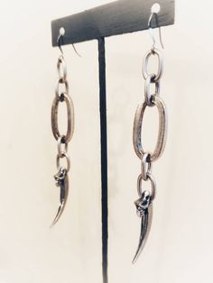 "Temporary August Shipping Delays. Orders may take 7-10 business days to ship. Chunky Raven Claw Earrings Chunky chain with cast raven claws on ear wires. lead free pewter Always ethically sourced bones. Nothing has ever been harmed for the purpose of our jewelry. All pieces are made-to-order despite the \"in stock\" number in the listing. Time frame varies from piece to piece so please message us if you need something by a certain date and we will do our best. A portion of our profits will be r Nickel-free Gunmetal Gothic Jewelry, Silver Dangle Grunge Jewelry, Edgy Metal Earrings With Ear Wire, Nickel-free Metal Grunge Earrings, Gunmetal Dangle Earrings Metal Jewelry, Nickel-free Metal Earrings In Grunge Style, Gunmetal Dangle Earrings, Gunmetal Dangle Jewelry, Grunge Dangle Metal Earrings