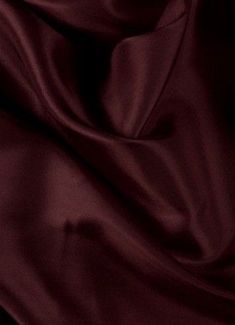 a close up view of a maroon fabric