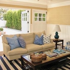 a living room filled with furniture and decor