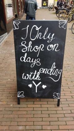 a chalkboard sign that says i only shop on days end with y