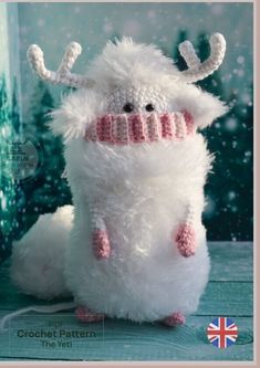 a white stuffed animal wearing a knitted hat and scarf, with the caption crochet pattern the yet