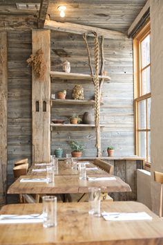 a wooden table and chairs in a room