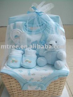 a baby gift basket with a teddy bear and other items