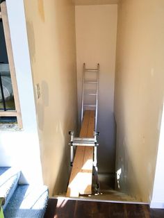 a ladder that is sitting in the corner of a room