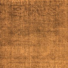 an area rug with brown and tan colors