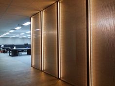 an office cubicle with privacy walls and desks