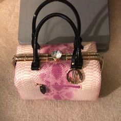 New And Very Glamorous Bag. Attachable Shoulder Strap Inside Purse. Pink/Black With Crystal Trim Around Entire Purse. Feet On The Bottom And A Sip In One Of Its Interior Walls And A Phone Pocket On The Other. New- Never Used! Pink Party Shoulder Bag With Handles, Pink Shoulder Bag With Top Carry Handle For Party, Glamorous Pink Rectangular Shoulder Bag, Glamorous Pink Bag For Everyday Use, Glamorous Pink Bags For Everyday Use, Glamorous Pink Clutch Shoulder Bag, Glamorous Pink Clutch Bag, Glamorous Pink Shoulder Bag For Evening, Glamorous Pink Shoulder Bag For Formal Occasions