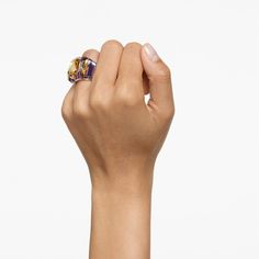 This captivating cocktail ring from the Chroma family is an ultramodern take on the traditional signet ring. Exploring the power of crystal through rhythm and layering, it features an innovative mix of violet and golden stones on a gold-tone plated setting. A geometric work of art ready to style with other bold designs, if you dare. Modern Gold Multi-stone Jewelry, Modern Gold Amethyst Ring, Stackable Ring Sets, Ring Purple, Pink Watch, Rose Gold Watches, Cuff Rings, Tennis Necklace, Single Earring