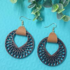 "wood and Leather Mandala Earrings These are comfortable, lightweight, and sure to get everyone's attention! Wood Piece 1.7\" walnut with gold tan leather Estimation drop Length: 2.25 Perfect for wearing from day to night, these earrings would be such a fun accessory. They can be super casual or dressed up. These earrings give you a laid-back, carefree style. All items are designed by me Each item is uniquely crafted and sent in a earring box for easy gift giving or storage." Wood And Leather Earrings, Wood And Brass Earrings, Leather Mandala, Brown Wooden Beads Round Earrings, Brown Wooden Earrings For Pierced Ears, Brown Wooden Round Earrings, Everyday Brown Wood Earrings, Brown Wooden Drop Earrings, Carefree Style