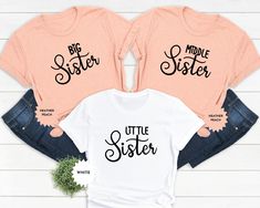 Celebrate sisterhood with our Matching Sister T-shirts! Featuring designs for big, middle, and little sisters, these tees are the perfect way to show off your sibling bond. Whether it's for a special occasion like a baby announcement or just for fun, these shirts make a heartfelt gift for sisters of all ages. Order now and create unforgettable memories with your sisters in these adorable matching tees! PLEASE READ BEFORE ORDERING * Please note that all products are custom made for each customer Baby Announcement Shirt, Baby Announcement Shirts, Middle Sister, Matching Sisters, Sibling Shirts, Sister Shirt, Sister Tshirts, Big Sister Shirt, Matching Tees