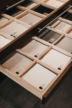 several drawers with papers on top of them