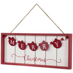 a merry christmas sign hanging from a string with ornaments on the clothes line and red letters that spell merry