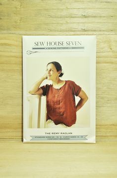 the front cover of a sewing pattern for a women's top with short sleeves