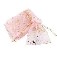 two pink bags with gold stars and moon on them