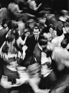 black and white photograph of people in motion