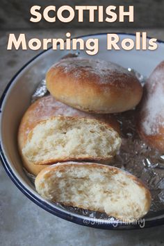 a bowl filled with donuts sitting on top of a table