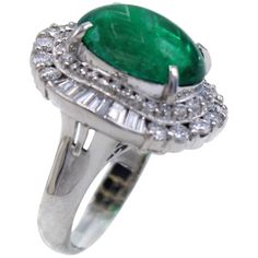 A luscious forest green cabochon emerald weighing 5.01 carats is the centerpiece of this bold platinum 1970s ring. The emerald comes with a report from the AGL. Embellishing the center gem are beautifully matched bright white round brilliant cut and baguette cut diamonds set upon a wavy gallery bringing out the wonderful fire and life of these gems. Ring size is 5.5 and can be sized. Width 19.36 mm Length 21.37 mm Item Number R859 Diamond Platinum Ring, Oxidized Silver Rings, Woman Jewelry, Ruby Diamond Rings, Platinum Diamond Rings, Emerald Diamond Ring, White Gold Set, Colorless Diamond, Diamond Jewelry Designs