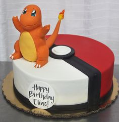 a birthday cake with a pokemon figure on top