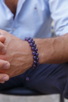 Men's Amethyst Macrame Bracelet. The handmade bracelet is made of a 10 mm Stainless Steel bead (on the bottom of the bracelet), and 8 mm natural Amethyst AA-grade beads (purple). All finished with a black waxed cord, at the ends I used Amethyst beads as stoppers. - The bracelet is adjustable and it could be made of any size (male or female). If you want a customized bracelet write a convo in your order with your wrist size. If a buyer does not specify a preferred size, bracelets will be made in standard sizes: 19,5-20 cm for men's bracelets, and 16,5-17 cm - for women's bracelets. - The bracelet is made of premium-quality gemstone beads. - It would be a perfect gift for any occasion. - Shipping Worldwide from Munich, Germany. - if you want to see my other items click https://www.etsy.com/y Men's Beaded Bracelets Handmade, Bracelets Stone, Bracelet Model, Artisan Purple Bracelet For Gift, Male Bracelets, Amethyst Bracelet For Men, Men Gemstone Bracelet, Male Stone Bracelet, Hand-strung Amethyst Bracelets Bohemian Style