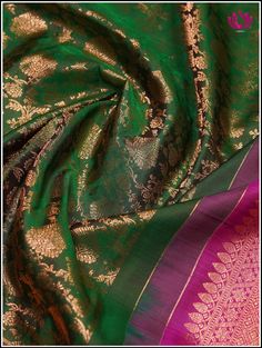 A Kanchipuram silk saree in a lush green shade, featuring intricate floral brocade designs is accentuated with a delicate pink border and pallu. This combination creates a captivating blend of colors and textures. The vibrant green tone symbolize freshness and vitality, while the floral brocade detailing adds an element of traditional charm and elegance. The gentle pink border infuses a soft and feminine touch, completing the graceful and natural aesthetic. Further, the floral and fauna motifs o Transitional Green Tissue Silk Lehenga, Green Transitional Raw Silk Traditional Wear, Transitional Green Raw Silk Traditional Wear, Green Tissue Silk Saree For Transitional Season, Transitional Green Tissue Silk Saree, Transitional Green Silk Lehenga, Transitional Season Green Silk Lehenga, Transitional Green Tussar Silk Traditional Wear, Transitional Green Raw Silk Saree