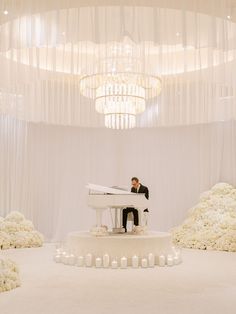 Piano and pianist at white wedding with with draping and chandelier. Musician is on a small round platform and surrounded in candles. Dream Wedding Reception, Bridal Trends, Indoor Wedding Ceremonies, White Wedding Theme, Luxury Wedding Decor, Dream Wedding Venues, Wedding Stage Decorations, Ceremony Music