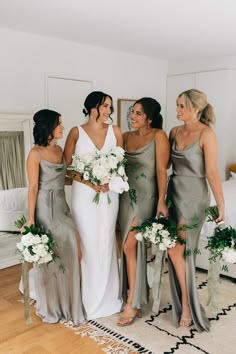 four bridesmaids laughing together in the bridal room