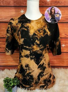 a black and yellow tie dye t - shirt with an image of the character frozen princess on it