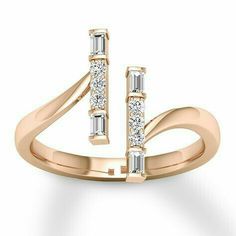 a rose gold ring with three stones on the front and two diamonds on the back