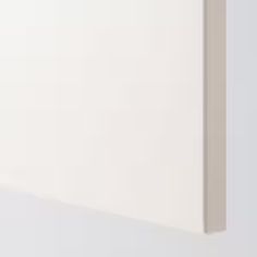 the corner of a white wall that has been painted