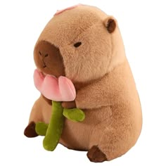 a stuffed animal holding a flower in its mouth