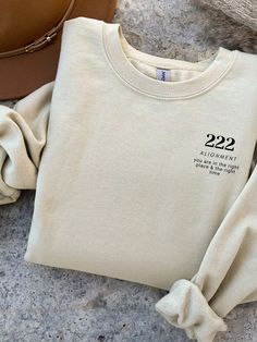 Angel number 222 with inspirational quote is a heavy blend crewneck sweatshirt is pure comfort. This sweatshirt is true to size and made from polyester and cotton. The collar is ribbed knit, so it retains its shape even after washing. There are no itchy side seams on this sweatshirt so it's great for the winter making this angel number 222 sweatshirt a great gift this year for Birthday or Christmas stocking filler. Merchandise Ideas Clothing, Brand Merchandise Ideas, Crewneck Design Ideas, 333 Angel Numbers, 444 Angel Numbers, Hoodies With Sayings, Affirmation Clothing, Positive Clothing, Crewneck Outfit