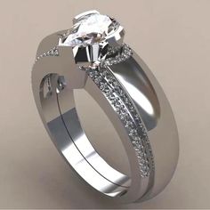 a wedding ring with a diamond on the side