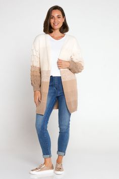 Wrap yourself in luxury with the Benita Knit Cardi in Latte Ombre, a statement piece for your wardrobe. This open-front cardigan boasts drop shoulders and statement bishop sleeves with accent knit details, adding a touch of sophistication to any outfit. With wide, ribbed cuffs and a generous length, it offers both comfort and style. Crafted from a chunky knit, it exudes warmth and coziness, making it perfect for layering during cooler seasons. Elevate your look with this chic and versatile cardi. Open front Drop shoulders Statement bishop sleeves with accent knit details Wide, ribbed cuffs Generous length  Chunky knit Knit Cardi, Open Front Cardigan, Front Open, Drop Shoulder, Knitwear Women, Chunky Knit, Knitwear, Wardrobe, Knitting