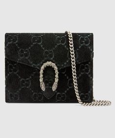 Description The GG is a nearly 100-year-old symbol that has been brought back into the forefront of Gucci’s designs in unexpected ways. The motif is presented on a Dionysus mini-chain wallet made in velvet. The design can be using a chain shoulder strap. Size: 8″W x 5″H x 2.3″D / W 20.3 cm x Hv12.7 cm x D 5.9 cm 100% genuine materials, matching the quality of the Gucci product (imported from Europe); Black GG velvet Black palladium-toned hardware Tiger head spur Hand-painted edges Hand-stitched details 16 card slots and two bill compartments Three separate interior compartments Zip coin pocket Chain shoulder strap with 23.5″ drop Snap closure Comes with dustbag, ation cards, and pamphlets 1:1 mirror image qualityDelivery 5-8 or 10-15 working days Please note that during high season and Sal Gucci Chain Wallet, Velvet Gucci, Gucci Chain, Wallets Designer, Pocket Chain, Old Symbols, Gucci Gifts, Chain Wallet, Tiger Head