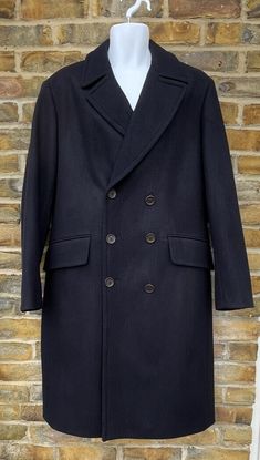 KINGLOUIEVINTAGE   Quality Vintage & British made clothing DESCRIPTION = Vintage 2000's Top quality pure wool blue classic overcoat. Collared neck with notched lapels and six button double breast front opening. Two front flapped pockets (still unstitched) with rear double buttoned belt and single rear buttoned vent.  Outstanding heavy pure wool coat in mint condition.  BRAND = Daks of London SIZE (UK) = 40 CONDITION :- = Excellent, Practically unworn MEASURMENTS (Inches) = ARMPIT - ARMPIT :- 20" Classic Blue Pea Coat With Double Button Closure, Classic Blue Double-breasted Peacoat, Classic Blue Double-breasted Pea Coat, Blue Wool Peacoat For Formal Occasions, Classic Formal Peacoat With Concealed Placket, Classic Blue Peacoat With Buttons, Classic Blue Wool Outerwear, Classic Blue Wool Coat For Formal Occasions, Blue Wool Coat With Button Closure For Formal Wear