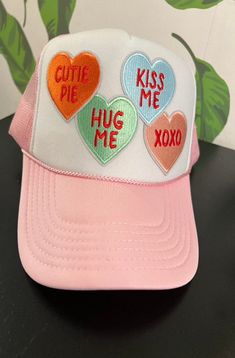 Score some conversation hearts with our adjustable Trucker Hat! With a foam front and breathable mesh back, you'll stay cool and stylish while spreading some love. Perfect for any casual look, this hat is a sweet addition to your wardrobe. (Love is in the air!) Cheap Playful Trucker Hat With Letter Print, Conversation Heart, Conversation Hearts, Converse With Heart, Love Is In The Air, Fit Check, Stay Cool, Casual Looks, Trucker Hat