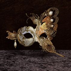 Venetian Masquerade Mask for Man or Woman - Traditional and original Venetian mask made of papier-mâché, handmade and decorated with acrylic colours, gold leaf and glitter. All our masks are handmade papier-mâché masks made in Venice. Our decorators use traditional Venetian techniques such as stucco, acrylics, gold and silver leaf, macramé, trimmings, glitters and crequelè to offer a wide range of original handmade masks and decorations This shape is available in different colors and is consider Luxury Baroque Masquerade Mask For Costume, Luxury Gold Venetian Masquerade Mask, Luxury Elegant Masks And Prosthetics For Theater, Traditional Luxury Gold Masquerade Mask, Luxury Traditional Gold Masquerade Mask, Luxury Traditional Masquerade Mask For Festivals, Luxury Artistic Masquerade Mask For Festivals, Luxury Elegant Baroque Masquerade Mask, Luxury Evening Masquerade Mask For Carnival