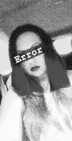 a woman wearing a blindfold with the word error on it